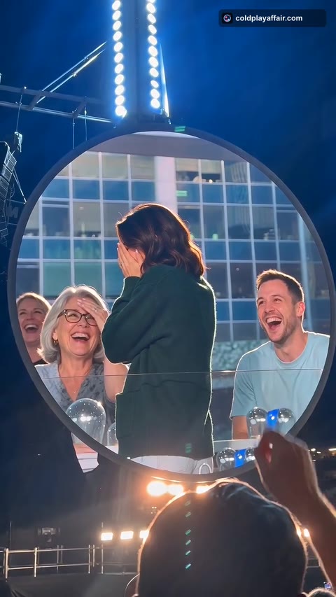 Coldplay Affair AI frame: the crowd beside them laughing